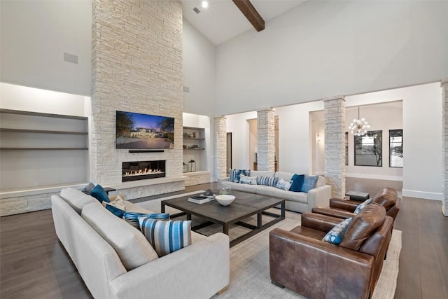 5609 Laceback Ter, Austin, TX 78738 - living room featuring decorative columns, high vaulted ceiling, wood finished floors, a fireplace, and beam ceiling