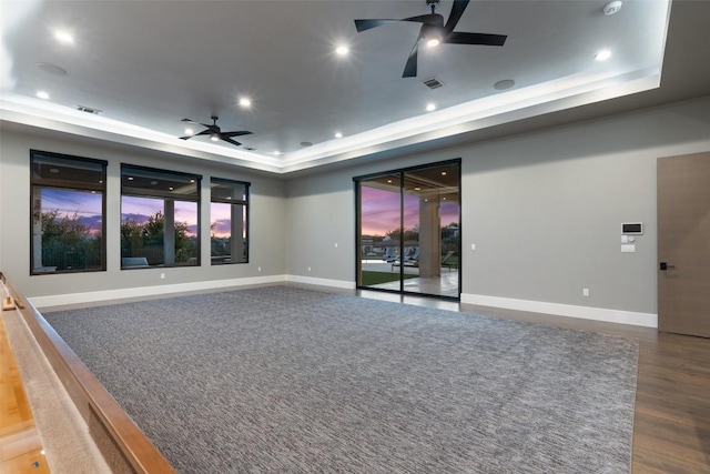 5609 Laceback Ter, Austin, TX 78738 - empty room with ceiling fan, a raised ceiling, wood finished floors, and recessed lighting