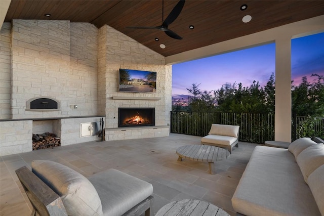 5609 Laceback Ter, Austin, TX 78738 - view of patio / terrace with an outdoor stone fireplace and a ceiling fan