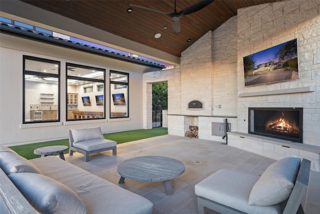 5609 Laceback Ter, Austin, TX 78738 - view of patio / terrace featuring an outdoor stone fireplace and ceiling fan