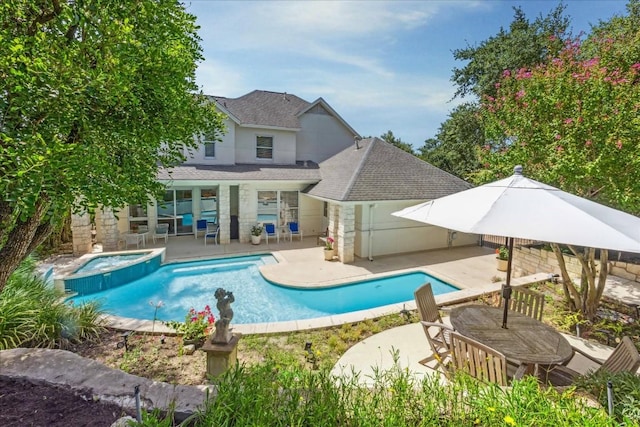 view of pool featuring a pool with connected hot tub and a patio