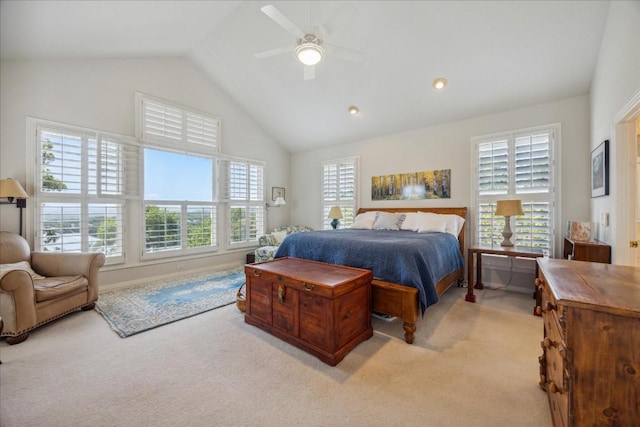 bedroom featuring light colored carpet, a ceiling fan, and high vaulted ceiling