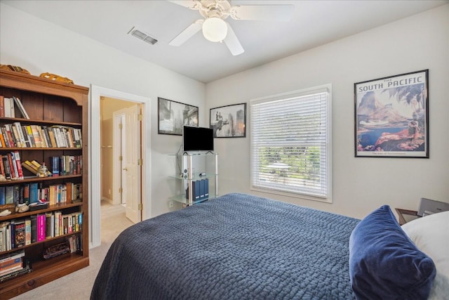 bedroom featuring carpet floors, a ceiling fan, and visible vents