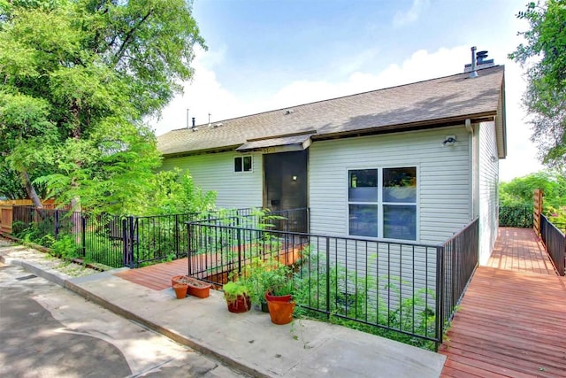 2208 Trailside Dr, Austin, TX 78704 - back of house with roof with shingles and fence
