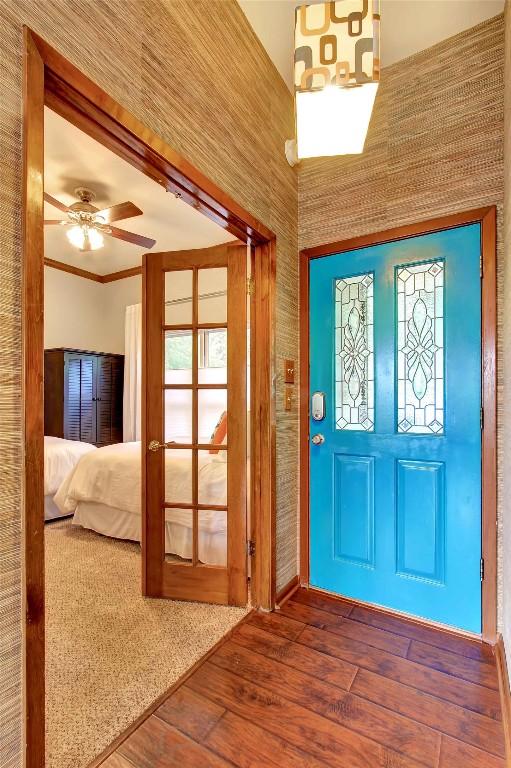 2208 Trailside Dr, Austin, TX 78704 - foyer entrance featuring hardwood / wood-style floors, crown molding, and ceiling fan
