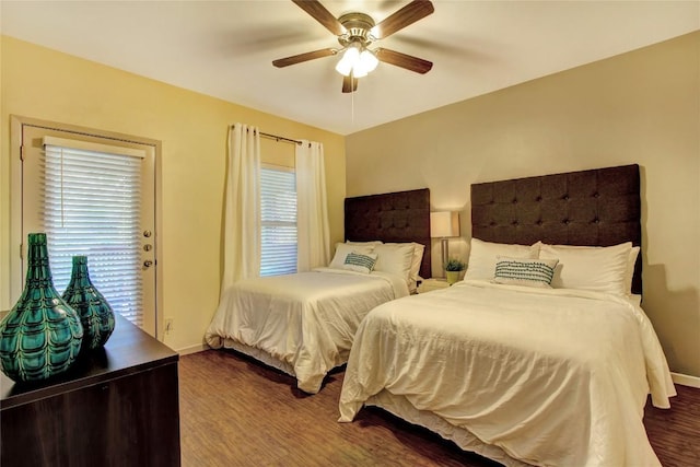 2208 Trailside Dr, Austin, TX 78704 - bedroom with dark wood finished floors, access to outside, baseboards, and a ceiling fan