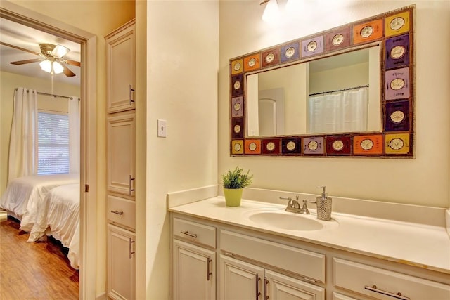 2208 Trailside Dr, Austin, TX 78704 - bathroom with vanity, a ceiling fan, and wood finished floors