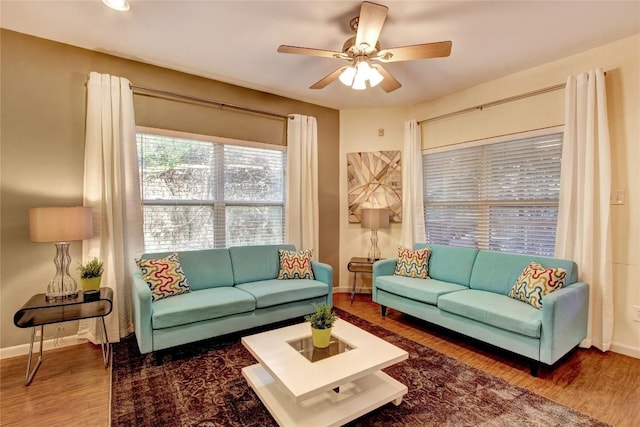 2208 Trailside Dr, Austin, TX 78704 - living area featuring a ceiling fan, wood finished floors, and baseboards