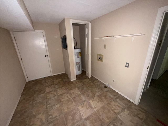 laundry area featuring baseboards, washer hookup, and electric water heater