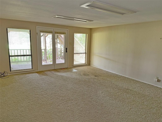 unfurnished room with light colored carpet