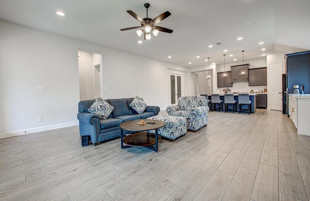 6320 Lipan Bayou Trl, Austin, TX 78738 - living room with light wood-type flooring, ceiling fan, and recessed lighting
