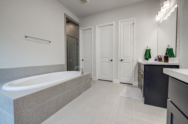 6320 Lipan Bayou Trl, Austin, TX 78738 - full bathroom featuring vanity, a shower stall, and a garden tub