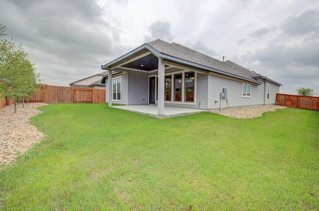 6320 Lipan Bayou Trl, Austin, TX 78738 - back of property with a patio, stucco siding, a fenced backyard, and roof with shingles