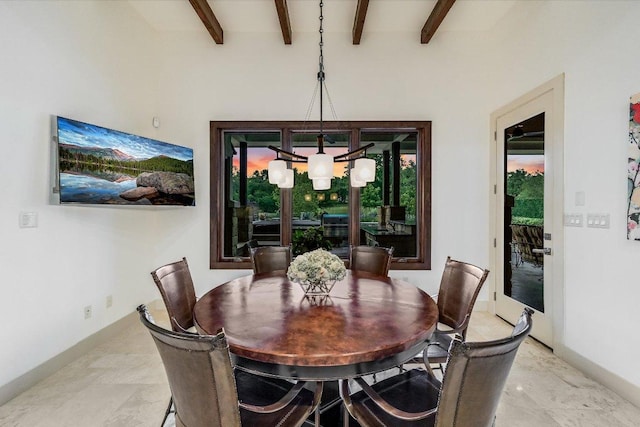 dining space featuring baseboards, beamed ceiling, and a chandelier