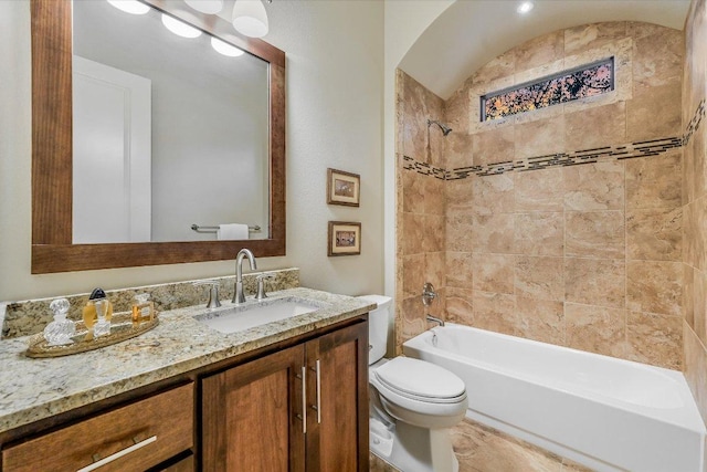 bathroom with toilet, vanity, and shower / tub combination
