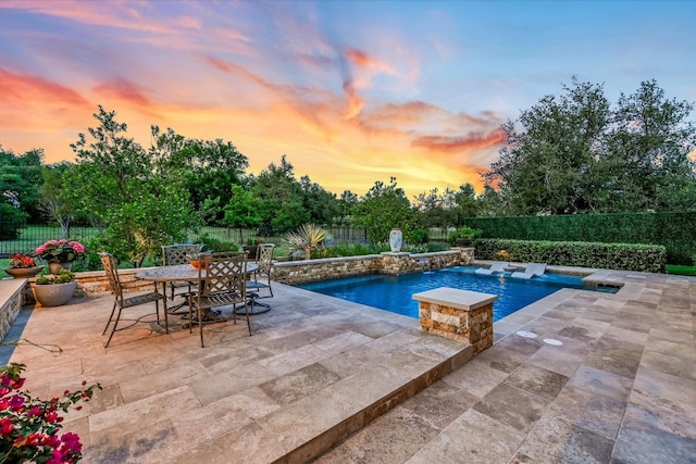 view of pool featuring a patio area, a fenced backyard, and a jacuzzi