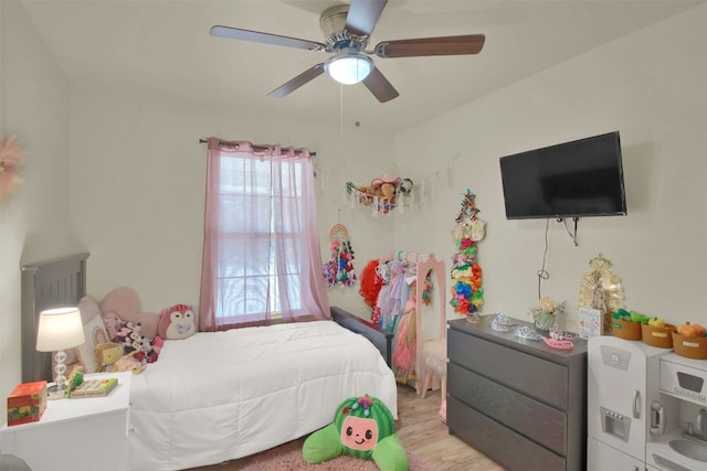 bedroom featuring a ceiling fan and light wood-style flooring