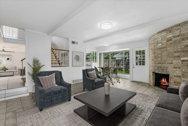 9010 Quail Creek Dr, Austin, TX 78758 - tiled living area with a fireplace and visible vents