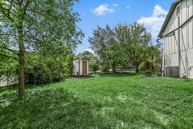 9010 Quail Creek Dr, Austin, TX 78758 - view of yard with cooling unit, an outdoor structure, fence, and a storage unit