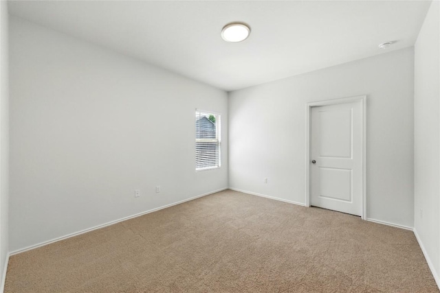 7013 Tonka Ln, Austin, TX 78744 - spare room with carpet flooring and baseboards
