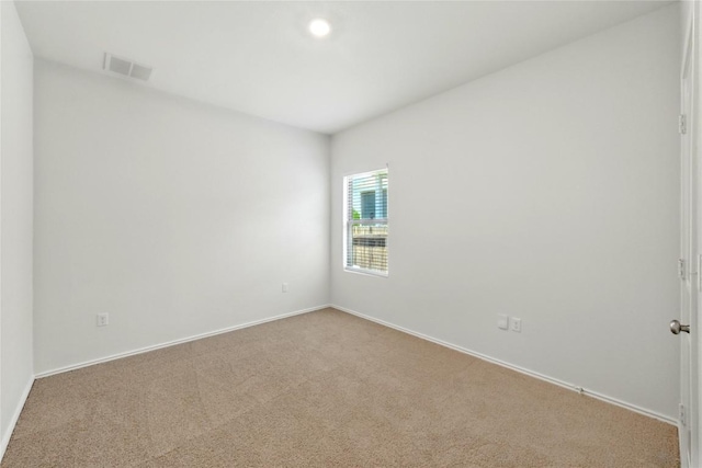 7013 Tonka Ln, Austin, TX 78744 - carpeted empty room with baseboards
