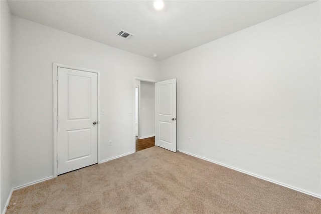 7013 Tonka Ln, Austin, TX 78744 - unfurnished bedroom with carpet flooring and baseboards