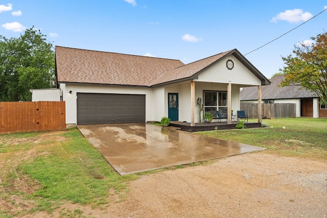 649 Aspen Ln, Cottonwood Shores, TX 78657 - ranch-style house with concrete driveway, an attached garage, a shingled roof, and covered porch
