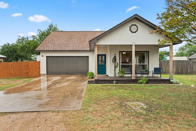 649 Aspen Ln, Cottonwood Shores, TX 78657 - view of front of home featuring a porch, an attached garage, driveway, and a shingled roof