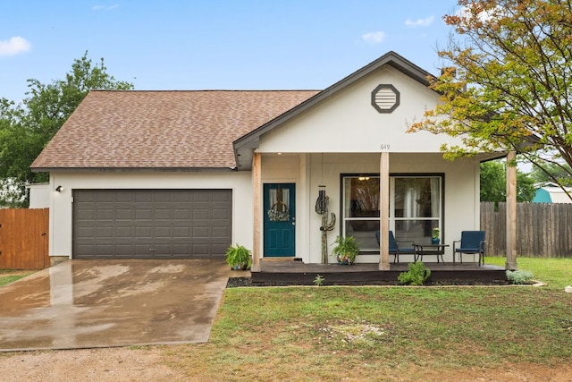 649 Aspen Ln, Cottonwood Shores, TX 78657 - view of front of home featuring covered porch, a garage, concrete driveway, and a shingled roof