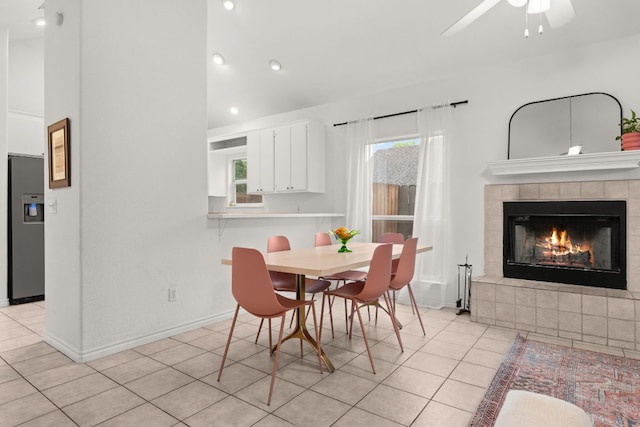 649 Aspen Ln, Cottonwood Shores, TX 78657 - dining room with plenty of natural light, light tile patterned floors, a tile fireplace, a ceiling fan, and recessed lighting