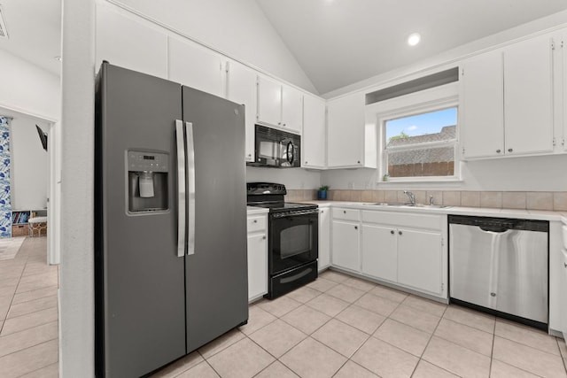 649 Aspen Ln, Cottonwood Shores, TX 78657 - kitchen with black appliances, vaulted ceiling, light tile patterned floors, light countertops, and white cabinetry
