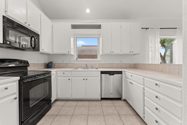 649 Aspen Ln, Cottonwood Shores, TX 78657 - kitchen with black appliances, a sink, white cabinetry, light countertops, and recessed lighting