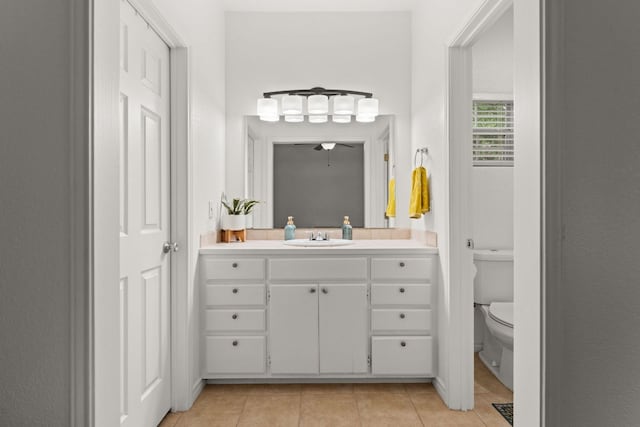 649 Aspen Ln, Cottonwood Shores, TX 78657 - bathroom with tile patterned flooring, toilet, vanity, and a ceiling fan