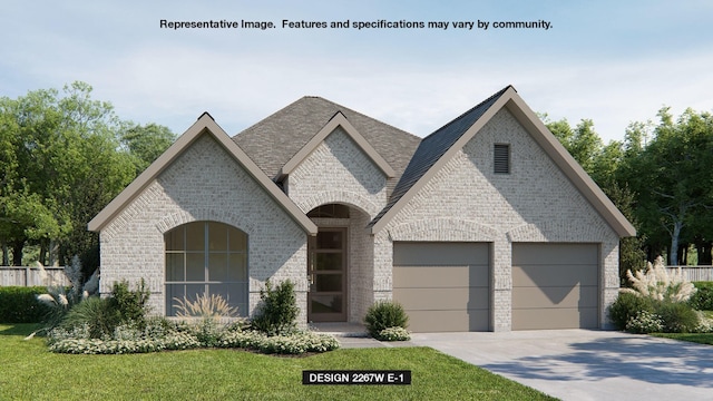 french country style house featuring brick siding, an attached garage, driveway, a front yard, and a shingled roof