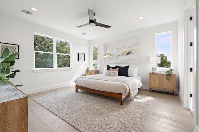 1702 Pennsylvania Ave, Austin, TX 78702 - bedroom featuring light wood-style floors, ceiling fan, recessed lighting, and baseboards