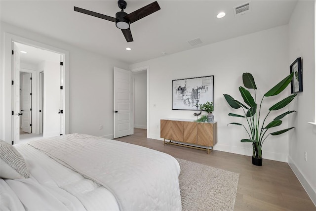 1702 Pennsylvania Ave, Austin, TX 78702 - bedroom with wood finished floors, recessed lighting, baseboards, and ceiling fan
