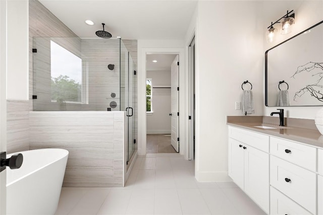 1702 Pennsylvania Ave, Austin, TX 78702 - bathroom with a shower stall, vanity, recessed lighting, a freestanding tub, and tile patterned floors
