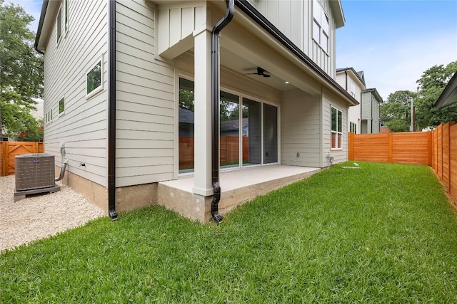 1702 Pennsylvania Ave, Austin, TX 78702 - rear view of house featuring central air condition unit, a patio area, and board and batten siding