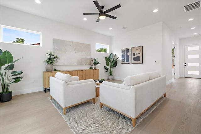 1702 Pennsylvania Ave, Austin, TX 78702 - living room with light wood finished floors, recessed lighting, a ceiling fan, and baseboards