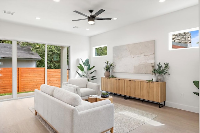 1702 Pennsylvania Ave, Austin, TX 78702 - sitting room with light wood-style flooring, ceiling fan, recessed lighting, and baseboards