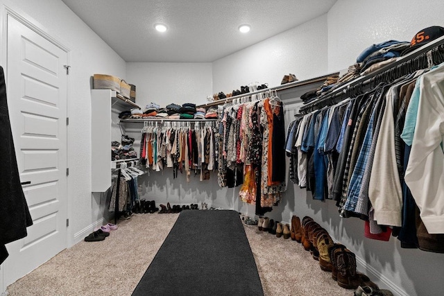 209 Northcrest Dr, Liberty Hill, TX 78642 - walk in closet with carpet floors