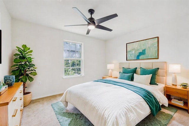 6900 Longford Trl, Austin, TX 78754 - bedroom featuring light carpet, a ceiling fan, and baseboards