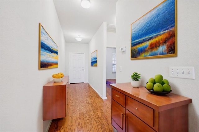6900 Longford Trl, Austin, TX 78754 - hallway with light wood-style floors and baseboards