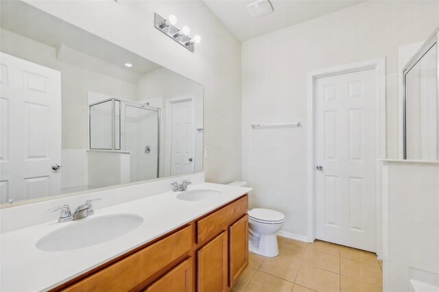 6900 Longford Trl, Austin, TX 78754 - full bathroom featuring a shower stall, tile patterned flooring, and double vanity