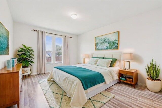 6900 Longford Trl, Austin, TX 78754 - bedroom with light wood-style floors and baseboards