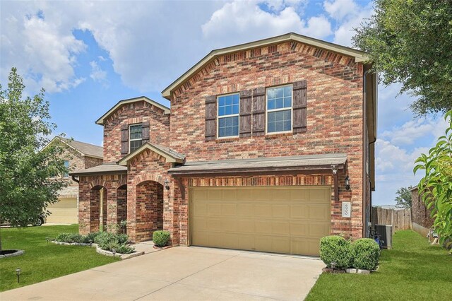 6900 Longford Trl, Austin, TX 78754 - view of front of home with brick siding, concrete driveway, and an attached garage
