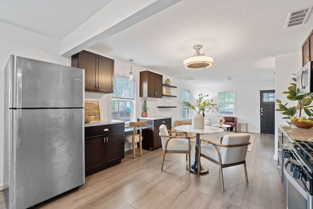 1156 Nickols Ave, Austin, TX 78721 - dining space featuring plenty of natural light and light wood-type flooring
