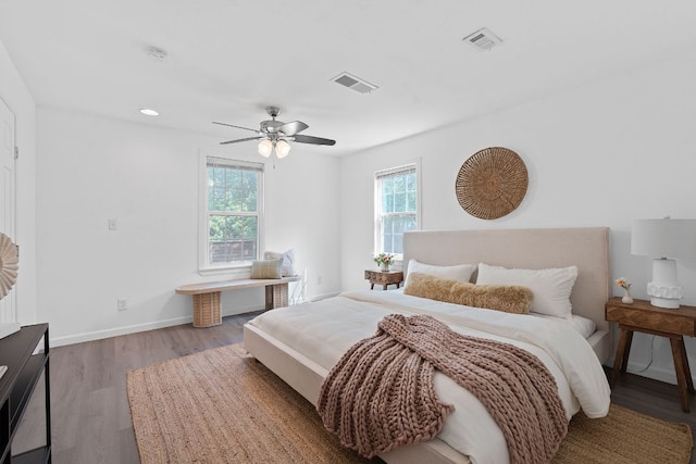 bedroom with wood finished floors, a ceiling fan, baseboards, and recessed lighting