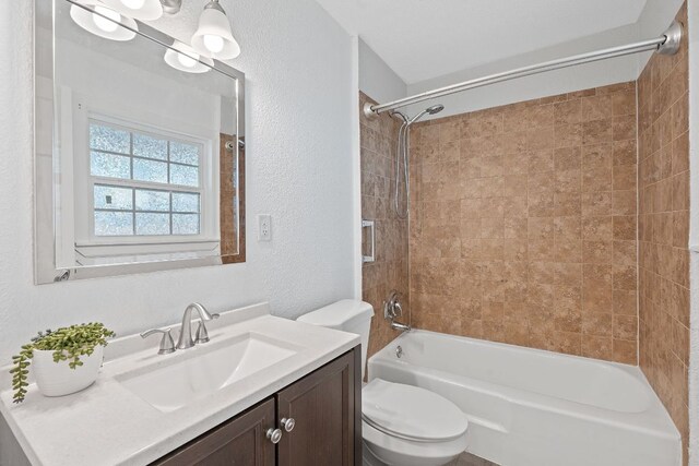 1156 Nickols Ave, Austin, TX 78721 - full bathroom featuring a textured wall, shower / bathtub combination, and vanity
