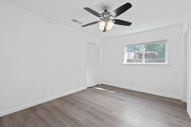 1156 Nickols Ave, Austin, TX 78721 - spare room with wood finished floors and a ceiling fan